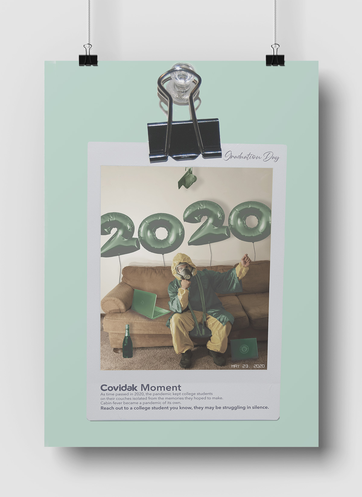 The third poster of the ad campaign series depicting a polaroid of a student sitting on a couch in a hazmat suit at zoom graduation. The student is also wearing a graduation robe and surrounded by celebratory objects such as a bottle of champagne and large balloons, but their demeanor is unenthusiastic.